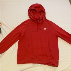 Red nike pullover sweatshirt with funnel-neck.